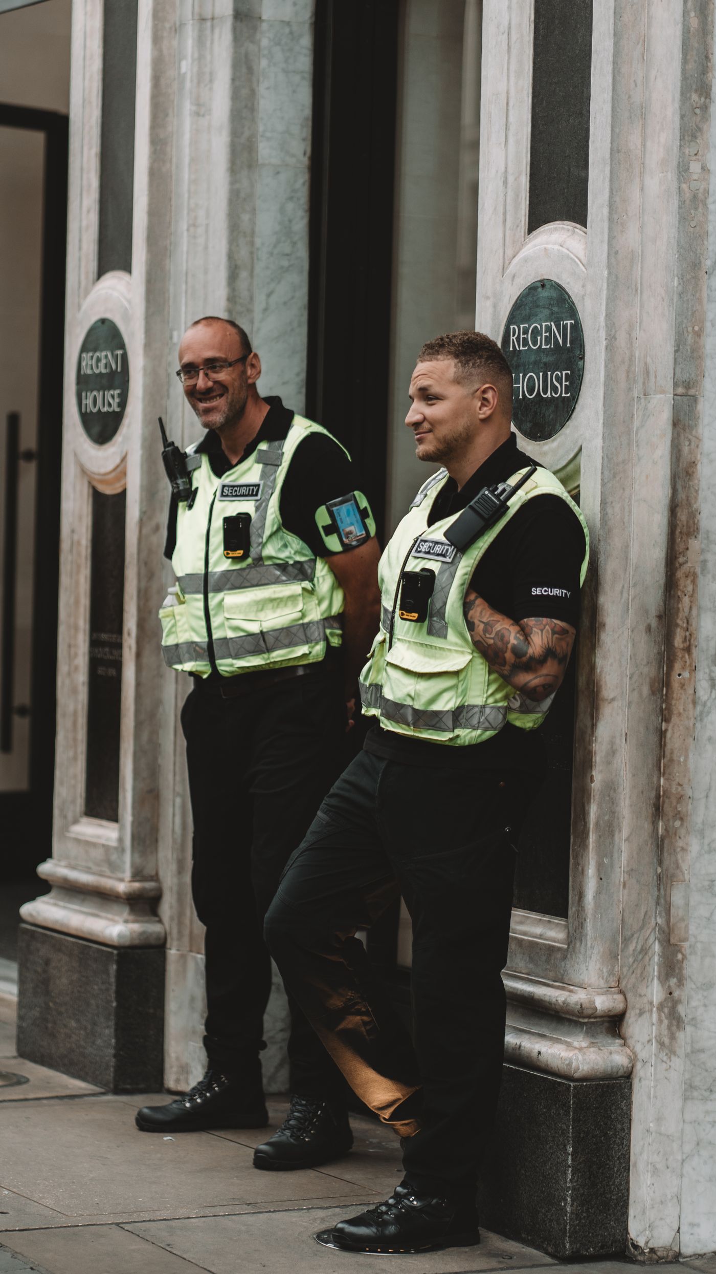 Security guards standing watch outside a building